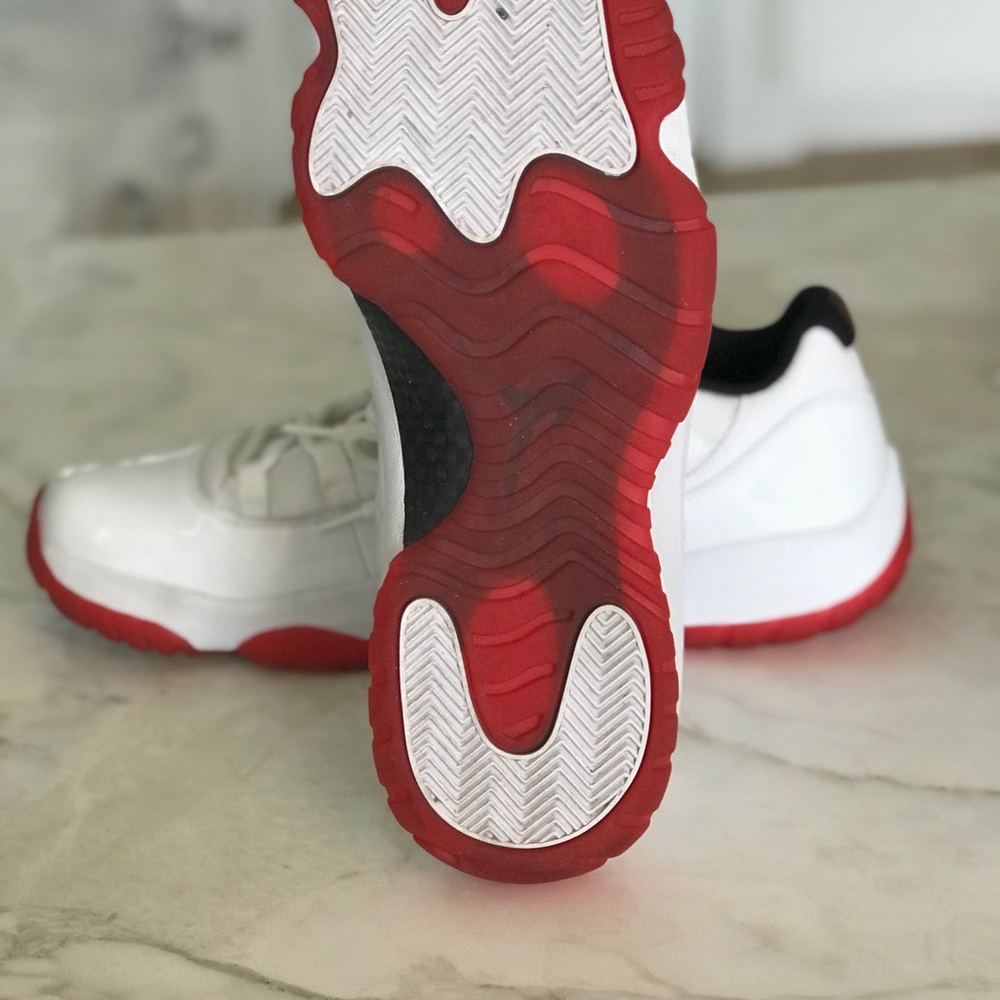 Jordan 11 low cherry red